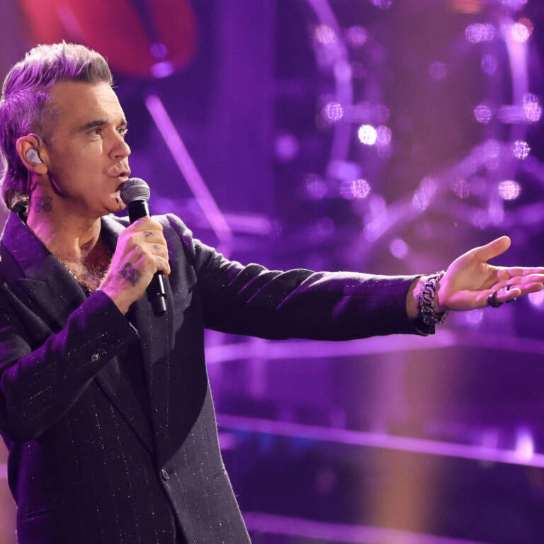 Robbie Williams: From Boy Band Star to Solo Legend