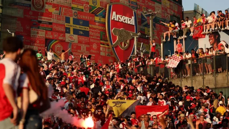 Arsenal players celebrate Premier League title with medals