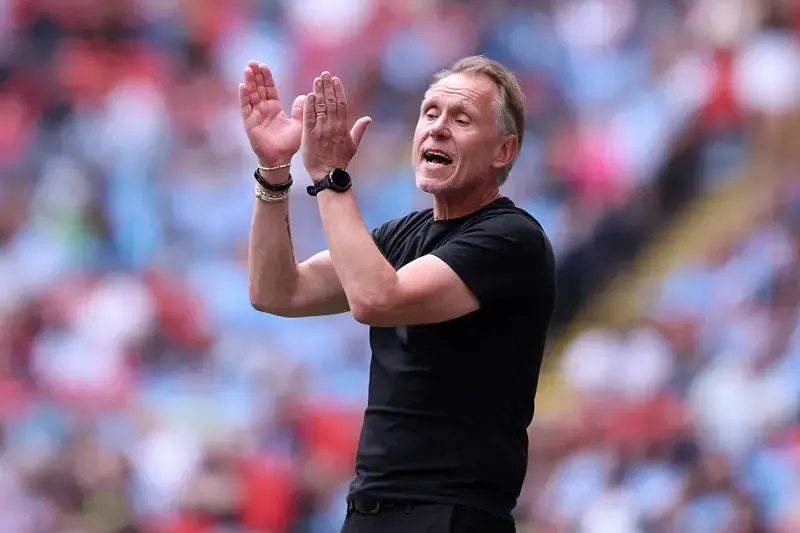 Andree Jeglertz, Manager of Manchester City, applauds