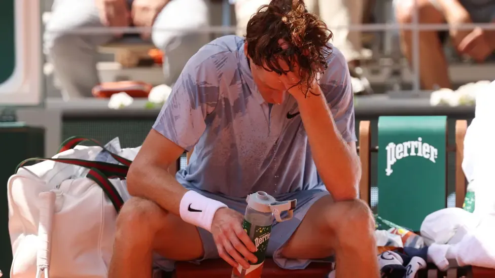 Jannik Sinner looks dejected during the changeover in his match against Juan Manuel Cerundolo at the 2026 French Open