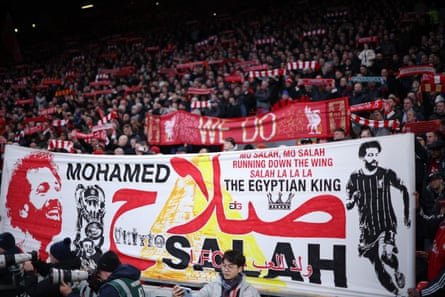 Liverpool fans hold up a banner celebrating Mohamed Salah