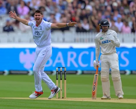 England bowler Josh Tongue appeals with arms outstretched while a batsman stands at the crease