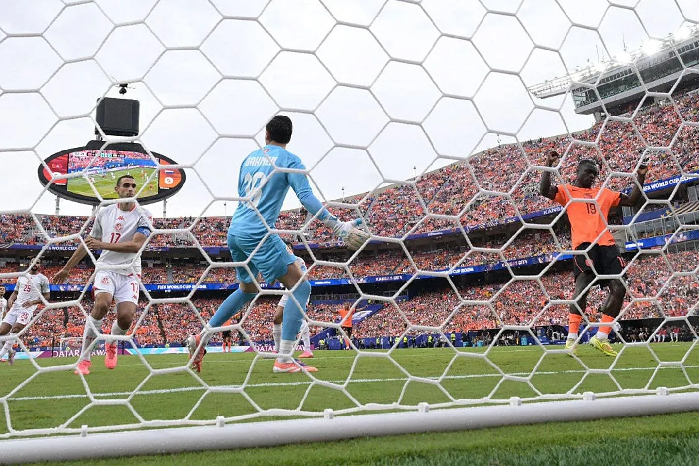 Netherlands' forward #19 Brian Brobbey (R) celebrates scoring his team's second goal during the 2026 World Cup Group F football match between Tunisia and the Netherlands at the Kansas City Stadium in Kansas City on June 25, 2026.