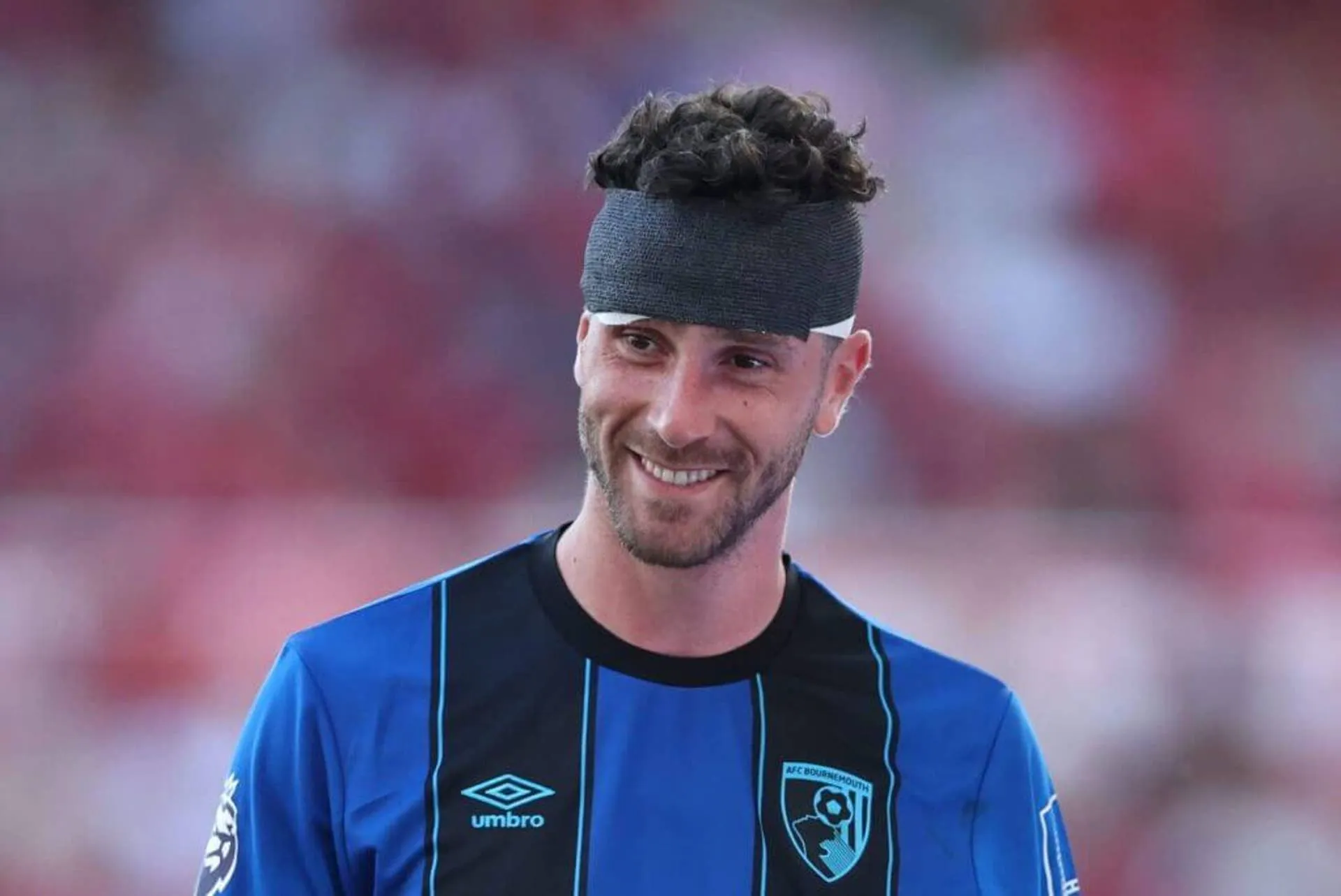 Senesi wearing a bandage on his head