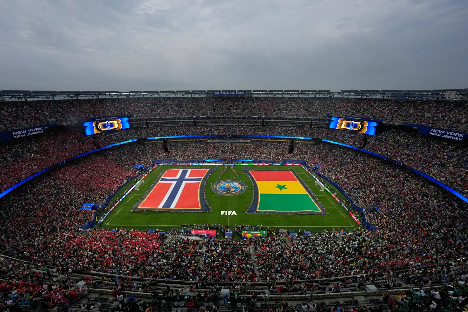 The flags of Norway and Senegal are displayed on the pitch before the World Cup Group I soccer match between Norway and Senegal in East Rutherford, N.J., near New York, Monday, June 22, 2026. (AP Photo/Stephen Collingwood)