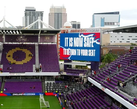 The big screen advising supporters they can return to their seats after a thunderstorm warning and deluge in Orlando before England v Costa Rica