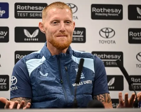 England captain Ben Stokes in a blue jacket gestures while speaking at a press conference on Wednesday.