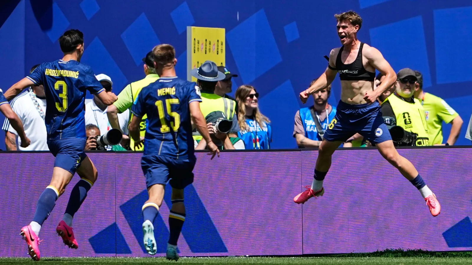 Bosnia's Ermin Mahmic, right, jumps as he celebrates with teammates after scoring his side's third goal during the World Cup Group B soccer match against Qatar in Seattle, Wednesday, June 24, 2026. (AP Photo/Lindsey Wasson)