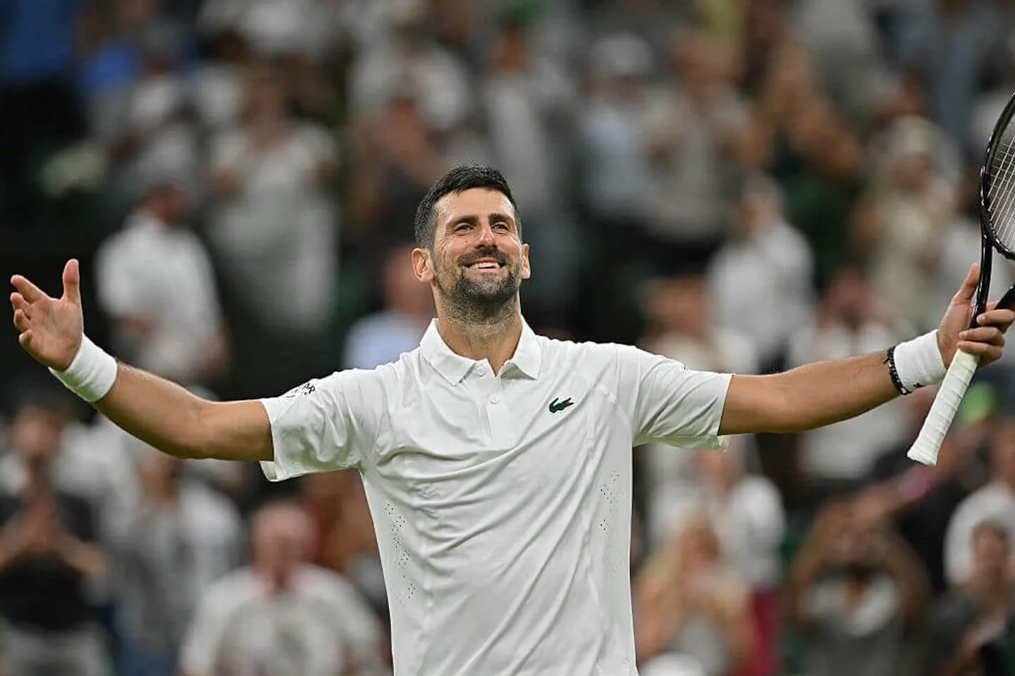 Djokovic wins in four sets at Wimbledon.