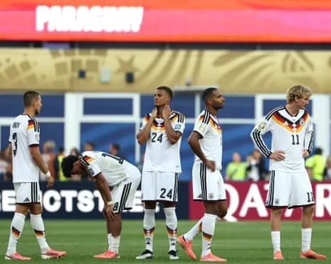 Germany’s players look downcast after the game