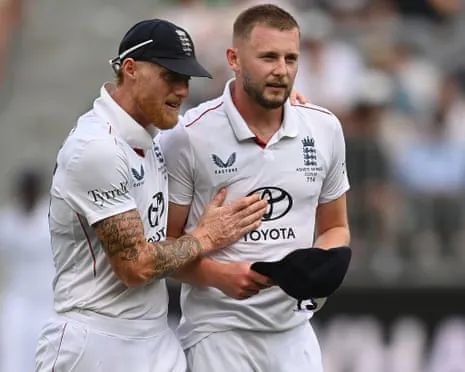 Ben Stokes and Gus Atkinson in England kit walking together, the former with his arm around the latter’s shoulder