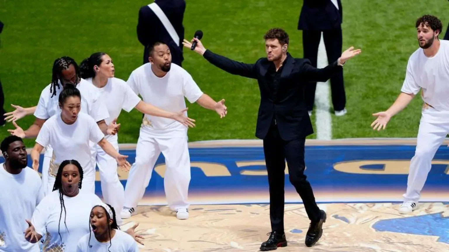 Reuters Michael Buble performing alongside other singers on the pitch