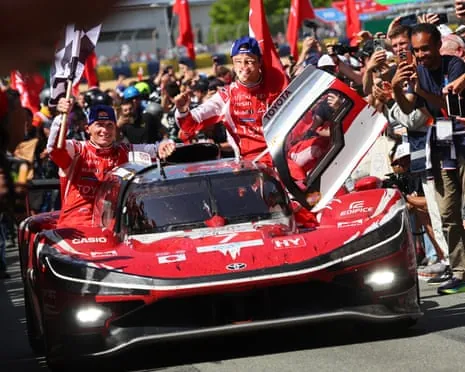 Britain’s Mike Conway, Japan’s Kamui Kobayashi and the Dutch driver Nyck de Vries celebrate their victory