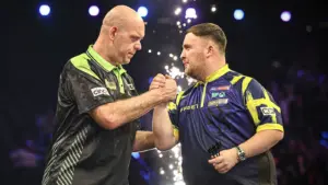 World Matchplay: Luke Littler throws nine-darter in thrilling win over Nathan Aspinall at Winter Gardens in Blackpool