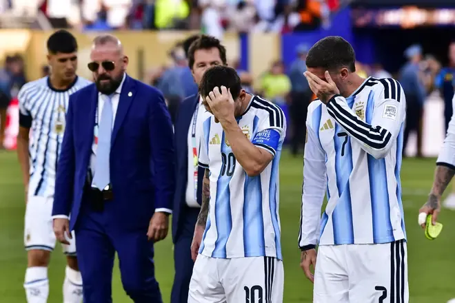 Lionel Messi and Rodrigo De Paul of Argentina at full time.