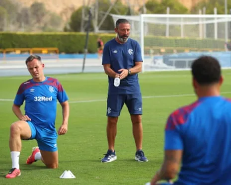 The Rangers manager, Derek McInnes, talks with Lawrence Shankland and Emmanuel Fernandez during a pre-season trip to Spain