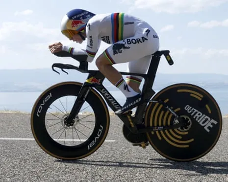 Remco Evenepoel powers along the time trial with Lake Geneva in the background