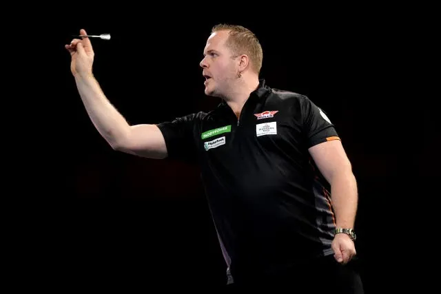 Dirk van Duijvenbode had no answer to the world champion’s relentless high scoring (John Walton/PA)