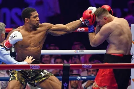 Anthony Joshua lands a punch on Albania's Kristian Prenga in Jeddah