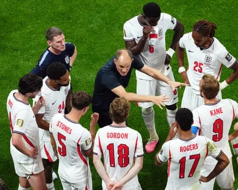 Thomas Tuchel speaks to his England players during a hydration break in the semi-final defeat by Argentina
